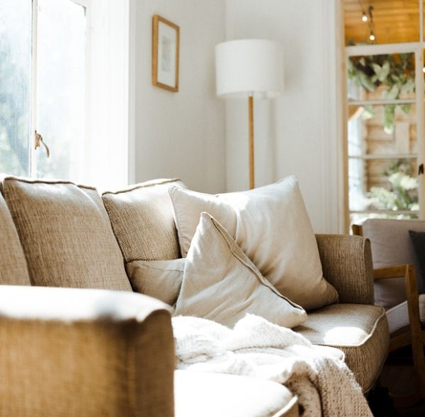 Olive-Counselling-Office-Vancouver-BC light grey couch with standing lamp and bright window light