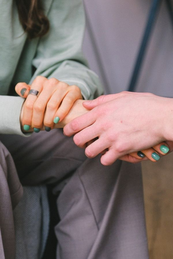 Olive-Counselling-Family-Counselling-Vancouver-BC close up of a comforting hand hold